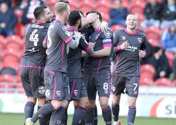 Morecambe's Peter Murphy is congratulated on scoring the first goal at Doncaster. Picture: Dean Atkins