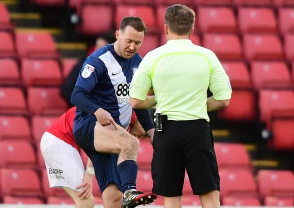 Preston North End's Aiden McGeady complains to referee Oliver Langford as he is shown a yellow card at Barnsley.