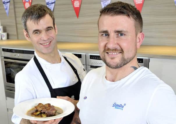 Former RAF Regiment gunner, Stuart Robinson, cooks up a storm alongside top chef Michael Wilson as he helps to launch the RAF Benevolent Funds Great British Sunday Lunch campaign. Picture:  Adrian Brooks/Imagewise