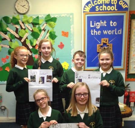 Students at Coppull Parish Church of England Primary School with their newspaper reports
