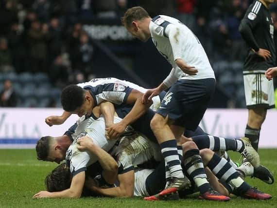 Daryl Horgan is mobbed after scoring his first Preston North End goal.
