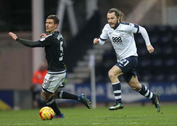 Stevie May takes on Brentford's Andreas Bjelland
.