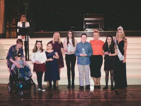 Rory Curzon Smith far left received the child of courage awards alongside five other youngsters at the Rock FM Time to Shine awards