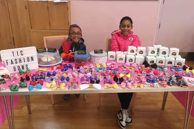 Tamia Charles (left) with her home-made bows, that are raising funds for the charity Sense