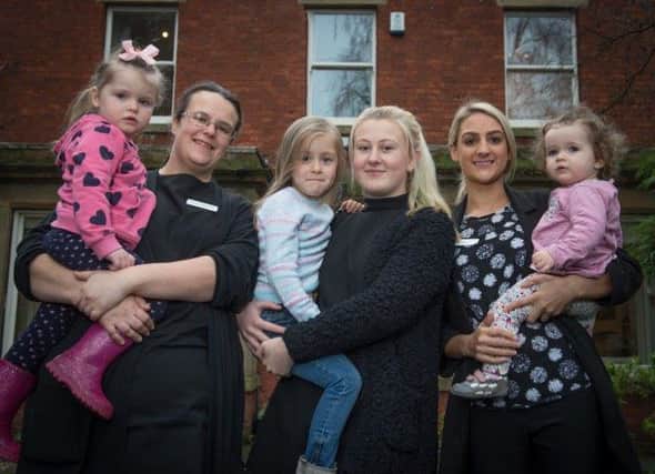 Deputy manager Claire Shuttleworth and children welcome new apprentice Beth Wilson (centre) and manager Jessica Low (right) to Poppy and Jacks in Fulwood