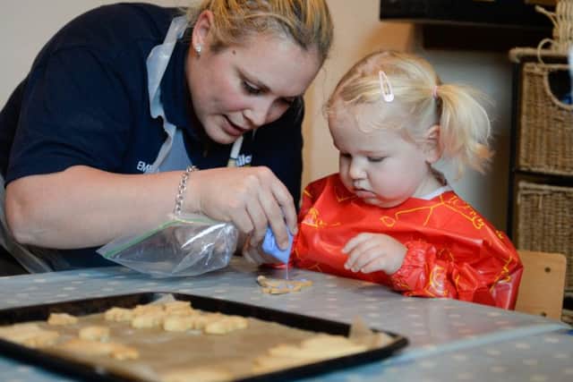 Emma Brown making cookies with one of the children at Poppy and Jack's in Fulwood