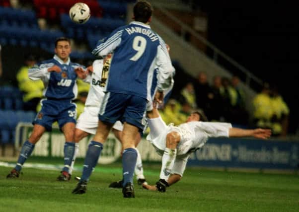 Michael Jackson hooks the ball into the net against Wigan in 2000
