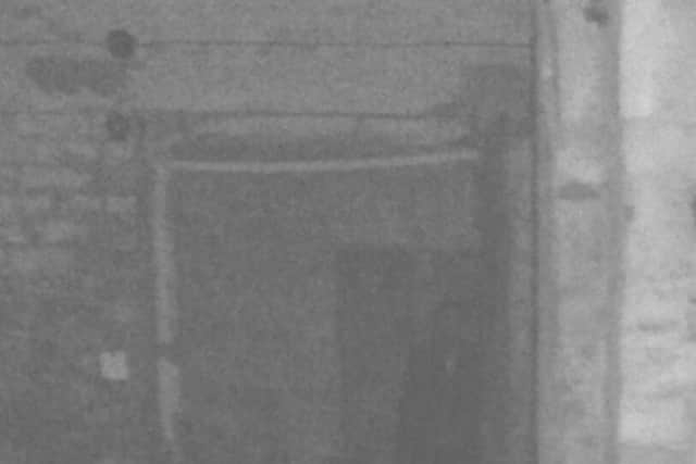 A dark figure pictured in Drakelow Tunnels, former underground military complex beneath the Kingsford Country Park north of Kidderminster