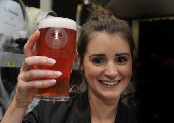 Rachel Osborne serves a perfect pint at the 13th annual beer festival and Pumpking at The Continental, Preston.