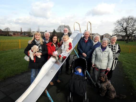 Sofia Vinaccia enjoying the slide with members of The Friends of Conway Park, who have finalised plans for the park in a joint project with Preston City Council and Lancashire County Council