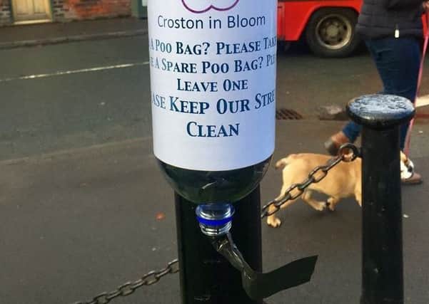 One of the dog poo bag dispensers in Croston village