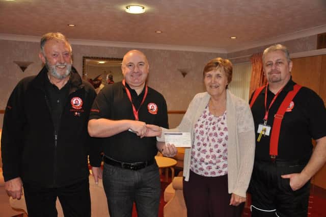 Members from North West Blood Bikes - Lancs and Lakes receiving the donation from Crafty Ladies in Penwortham