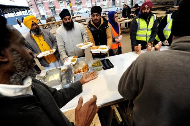 Members of the Sikh Society hold their first free food kitchen for the homeless and needy at Preston Flag Market. Picture by Paul Heyes, Sunday February 26, 2017.