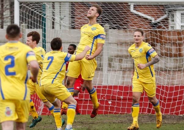 Tom Kilifin celebrates opening the scoring for Lancaster City at Ossett Town on Saturday. Picture: Mark Gledhill