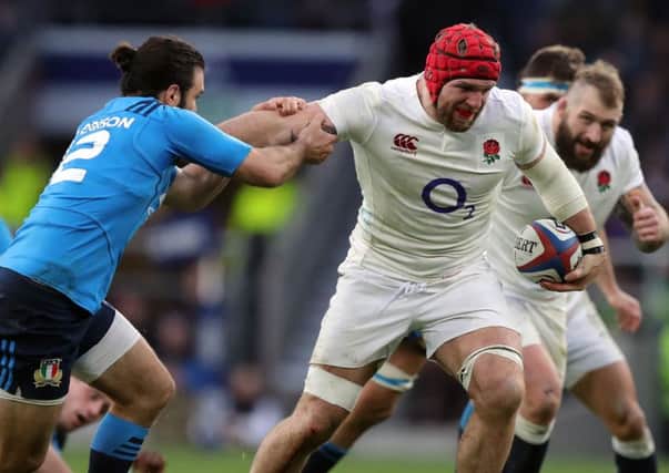 England's James Haskell hands off Italy's Giulio Bisegni during the Six Nations match at Twickenham