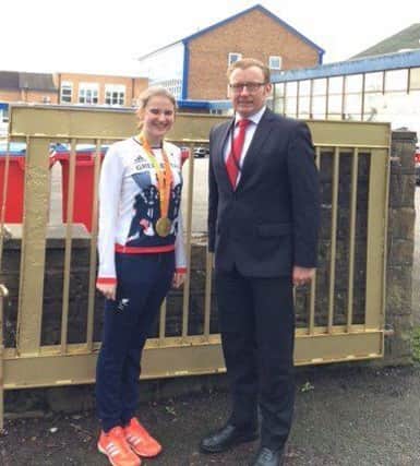 Gold Paralympian medalist Steph Slater pictured at the 'golden gates' of her former high school, St Cecilia's, Longridge with headteacher, Ivan Catlow.