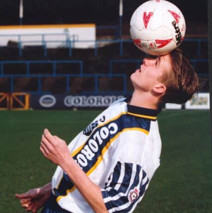 David Beckham poses for the cameras after signing on loan from Manchester United.