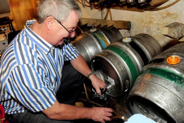 Steve Dilworth tends to his ale at the award winning Swan with Two Necks pub.
Photo Ben Parsons