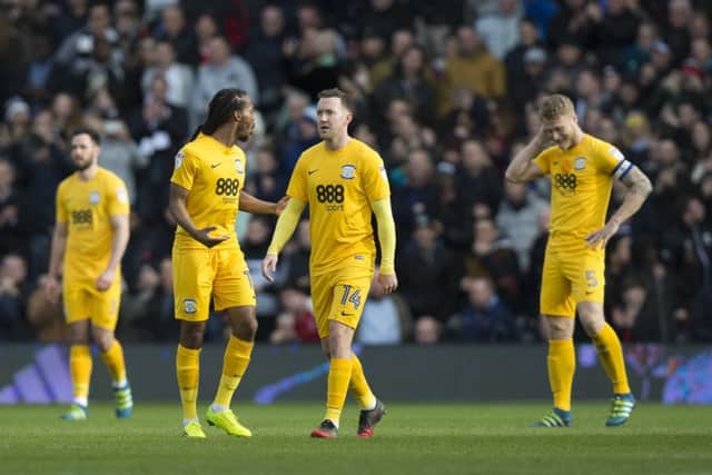 Preston North End's players look disappointed after conceding the opening goal against Fulham