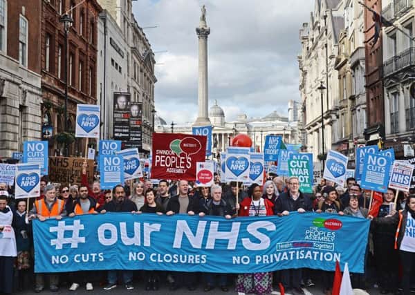 Demonstrators attend a rally in central London, in support of the NHS. PRESS ASSOCIATION Photo. Picture date: Saturday March 4, 2017. See PA story PROTEST NHS. Photo credit should read: Victoria Jones/PA Wire