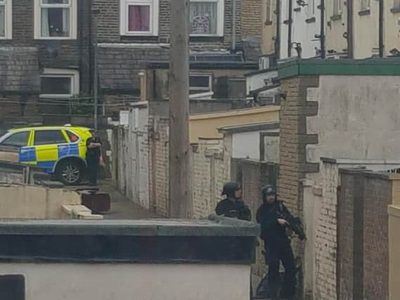 Armed police outside the house yesterday