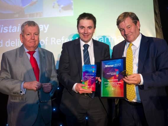Alistair Grey, Innovation Champion, with compere Lawrence McGinty and award presenter Lord Andrew Mawson