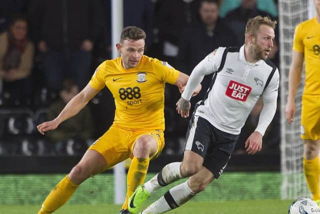 Andy Boyle shadows Johnny Russell during his PNE debut at Derby