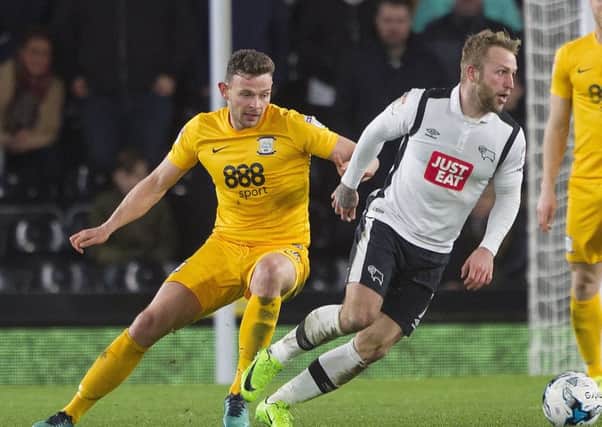 Andy Boyle shadows Johnny Russell during his PNE debut at Derby