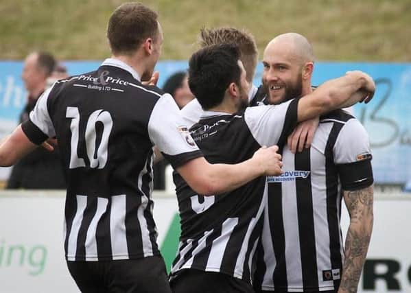 Players celebrate with goal scorer Andy Teague after netting Chorley's second. Pic credit Josh Vosper