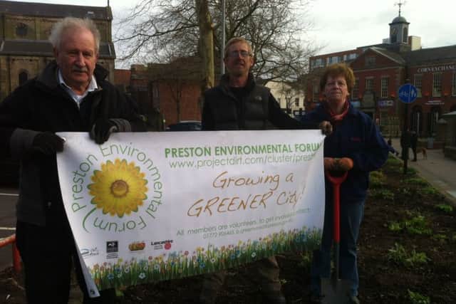 Members of Let's Grow Preston digging to make the city greener