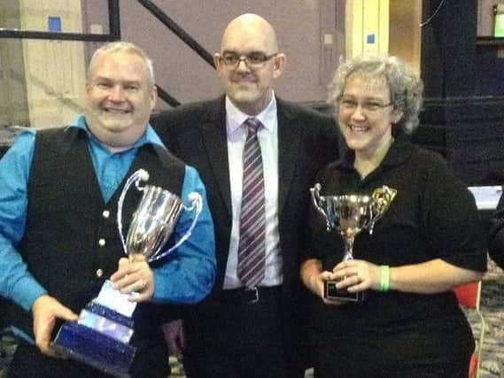 Chairman of Rivington and Adlington Band Dylan Taylor with cup
Dylan and secretary Janet Taylor along with the adjudicator Glyn Williams