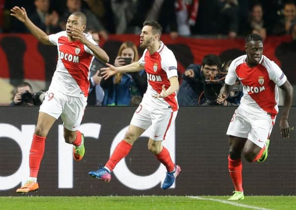 Monaco's Kylian Mbappe (left) is reportedly attracting interest from Premier League clubs