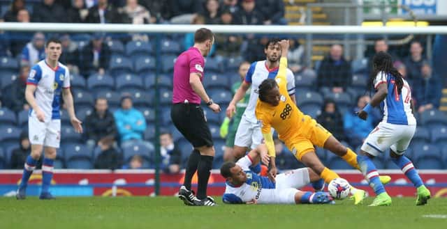 Daniel Johnson comes under pressure at Ewood Park.