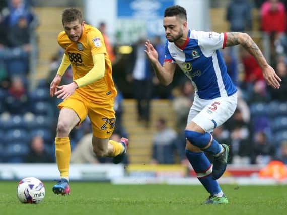 Tom Barkhuizen sprints down the wing at Ewood Park.