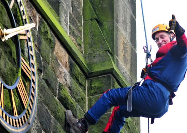 Photo: David Hurst
Volunteers abseil down St John's Church, Whittle le Woods in aid of St Catherine's Hospice. 
Chief Executive Stephen Greenhalgh descends dressed as Spiderman