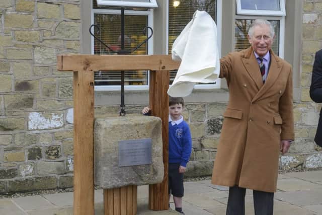 Prince Charles unveils the new plaque at Dewlay Cheesemakers in Garstang