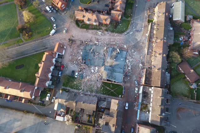Aerial over the the devastated buildings destroyed by a an explosion in Bebington, Wirral
