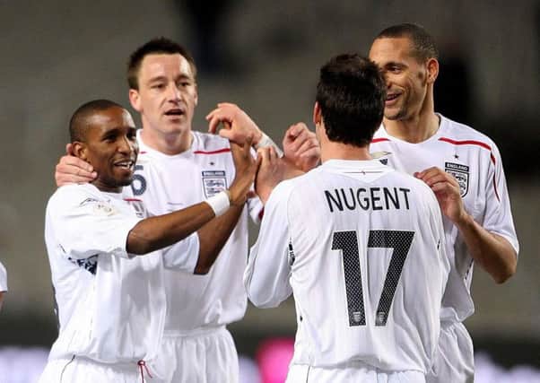 David Nugent celebrates his England goal with John Terry and Rio Ferdinand