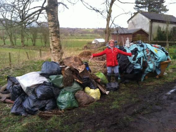 Carol Price with the litter collected at a previous clean up