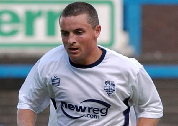 Michael Keane in action for Preston in 2003