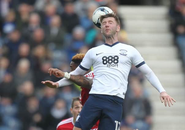 Paul Gallagher wins a header against Nottingham Forest.