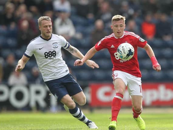Preston North End's Tom Clarke in action with Nottingham Forest's Ben Osborn