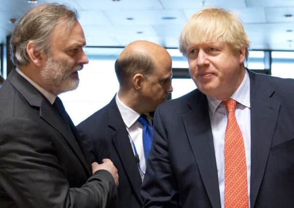 British Foreign Secretary Boris Johnson, right, speaks with the UK permanent representative to the EU, Tim Barrow.