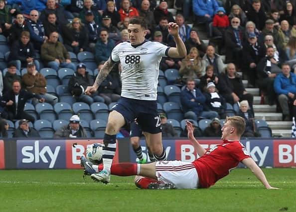 Jordan Hugill ia tackled by Nottingham Forest's Joe Worrall during the 1-1 draw at Deepdale