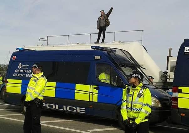 A photograph of a fracking protester on top of a Cuadrilla supply tanker at Preston New Road taken on April 3 by Ami Roberts.