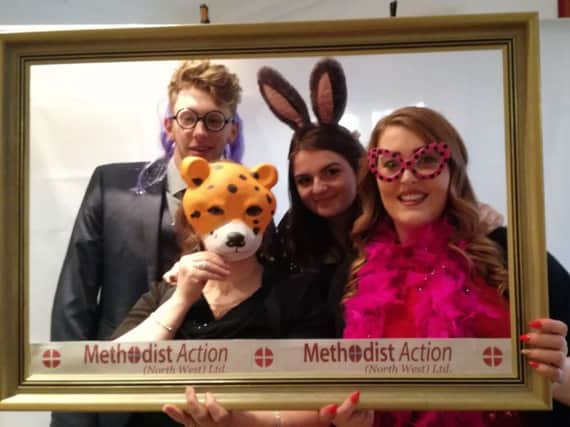 Guests dress up and have their photos taken in the Selfie Mirror at Methodist Action (NW)'s April Fool's Ball