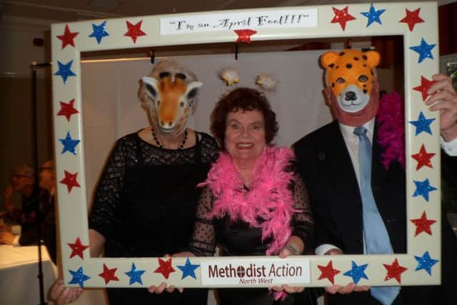 Guests dress up and have their photos taken in the Selfie Mirror at Methodist Action (NW)'s April Fool's Ball