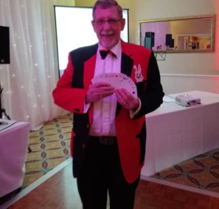 Magician Mr Jolly at Methodist Action (NW)'s April Fool's Ball