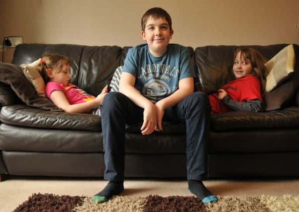 Photo Neil Cross
12 year old Daniel Giles has been working hard to raise awareness and acceptance for autism, pictured with twin sisters Kate and Emma