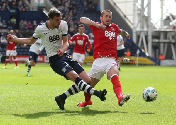 In black boots against Nottingham Forest last week
